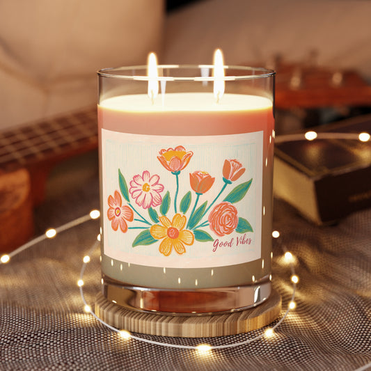 11 oz artisan-made, 100 % vegan soy wax candle with two cotton-cored whicks. It features a vibrant floral print and Good Vibes calligraphy. 