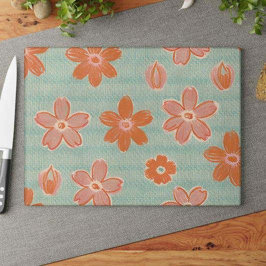 Tempered glass serving /chopping board with a plaid flower pattern design.