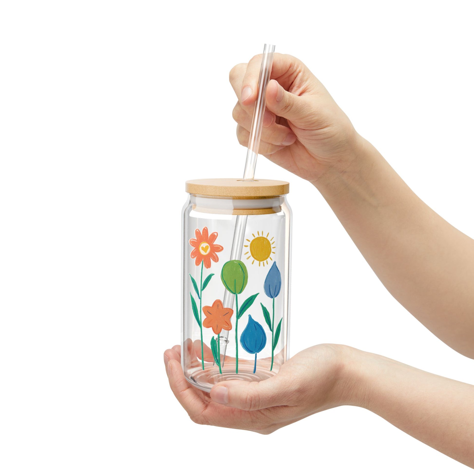 16oz Sipper Glass with Bamboo cover and plastic Tritan straw featuring a whimsical floral and sunshine print
