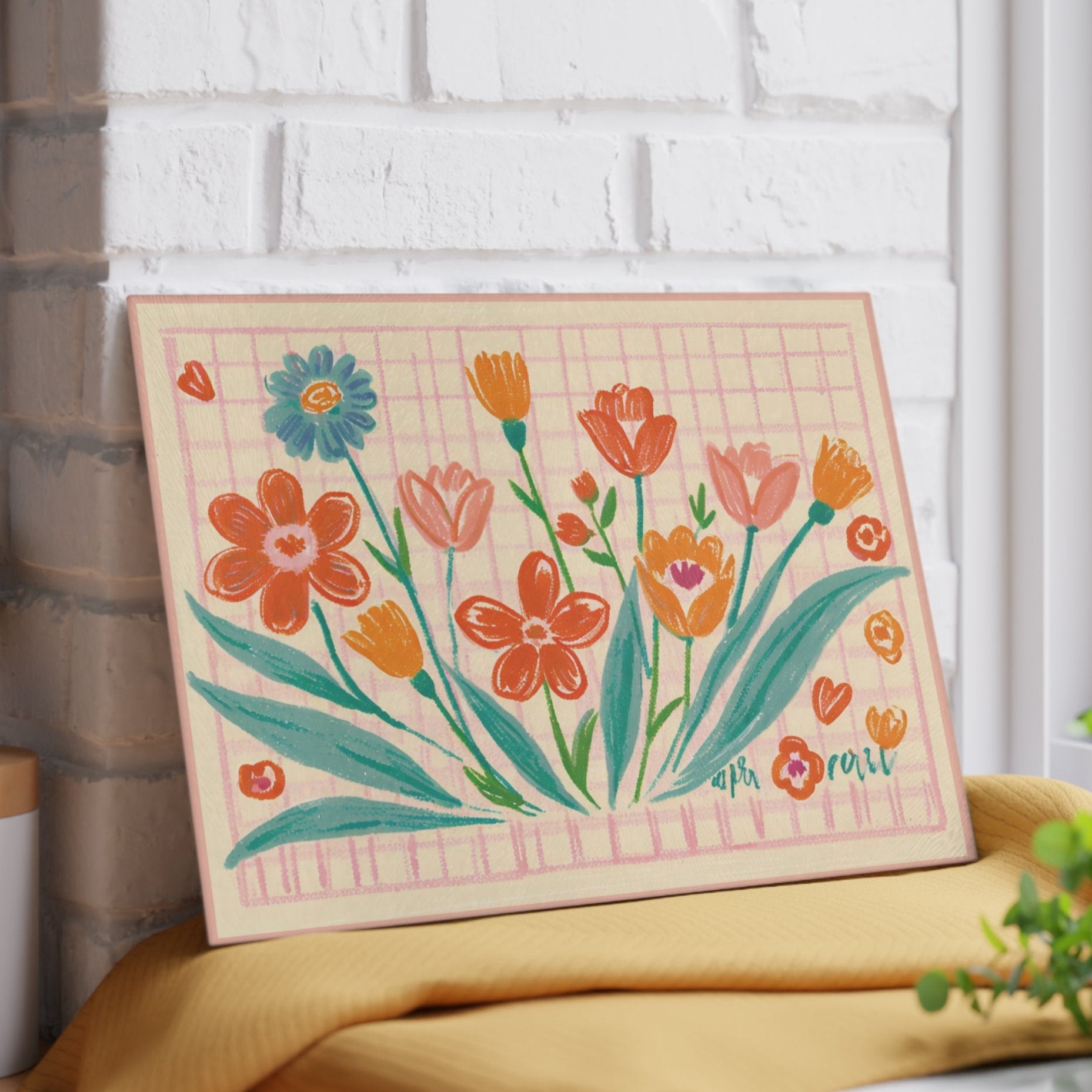 Tempered Glass Board for meal prep, serving and decorating. It features a wildflowers motif set over a pastel checkered pattern.